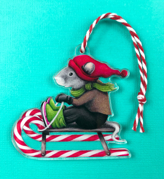 Abundance Illustration - Holiday ornament sledding mouse with striped string