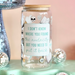 Glass jar with text on a stand with disco balls and a pink background