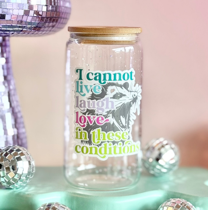 Glass jar with a motivational quote on a colorful background with disco balls and a disco mushroom.