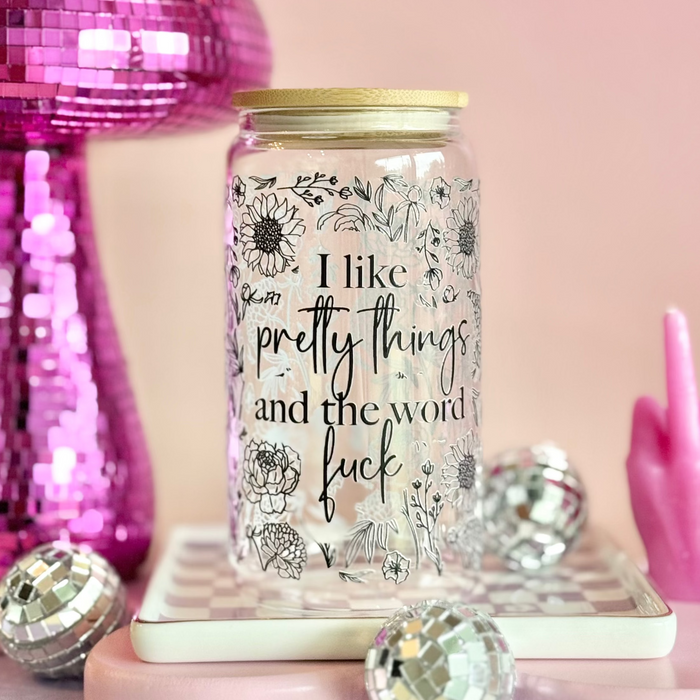 Jar with text on a decorative background with pink and disco ball elements