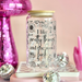 Jar with text on a decorative background with pink and disco ball elements